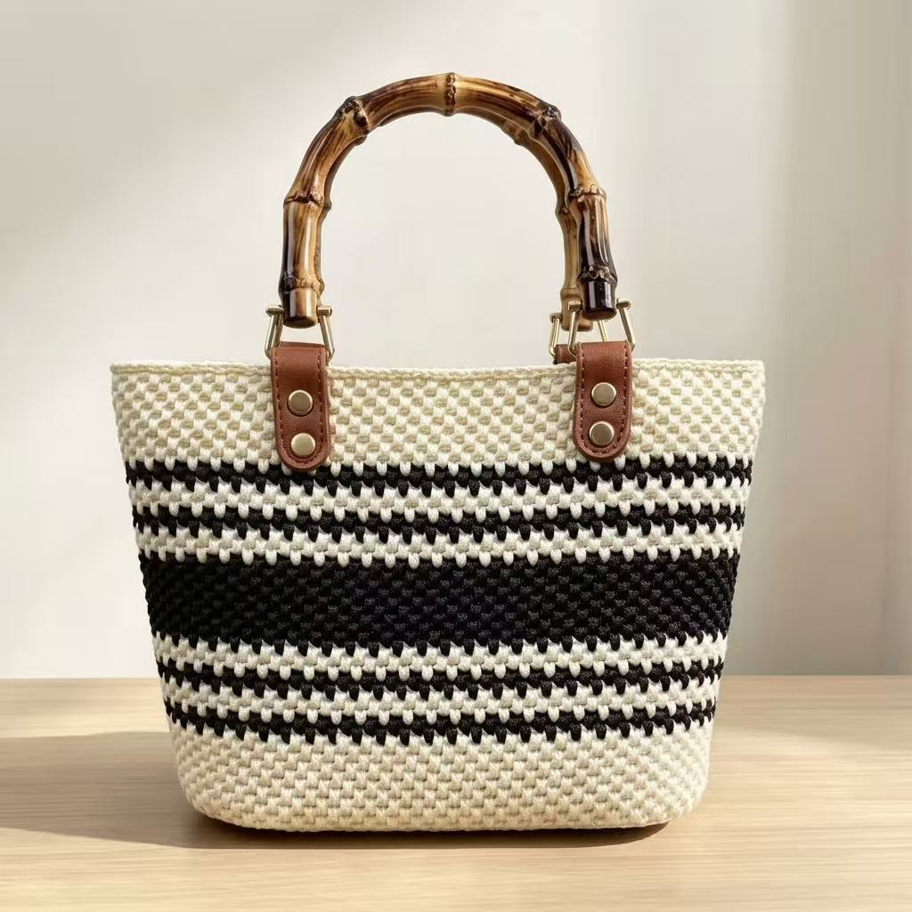 DIY beginner crochet handbag kit featuring cream and black stripes with vintage bamboo handle and brown PU leather connector.