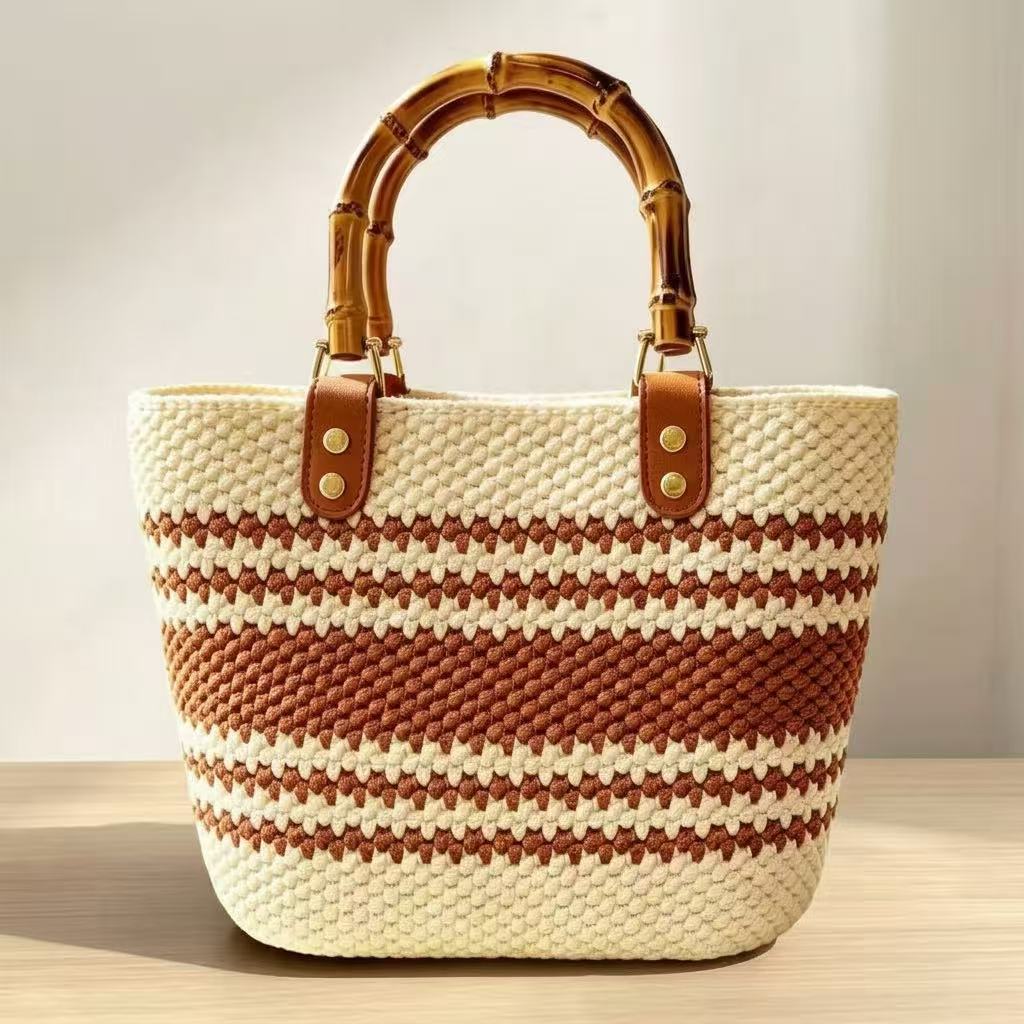 Handmade beginner-friendly crochet handbag in warm caramel brown and cream stripes with authentic bamboo handle 